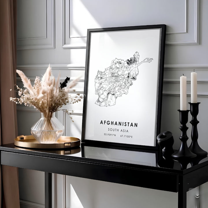 Black and white Afghanistan country map print featuring bold typography and exact latitude longitude coordinates, produced by MapYourDreams as an unframed paper print, ready to hang gallery canvas, or custom framed wall art setup in gold, silver, and grey frame finishes.