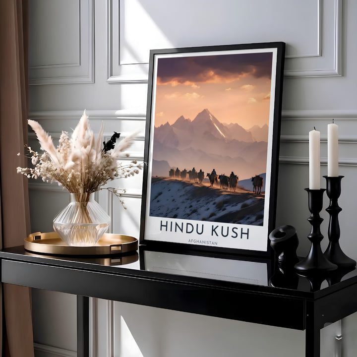Landscape photography wall art of the Hindu Kush mountains in Afghanistan showing silhouetted travelers on a ridge under glowing sunset clouds, crafted by MapYourDreams as an unframed art print, ready to hang gallery canvas, or framed wall decor in gold, silver, and white frames.