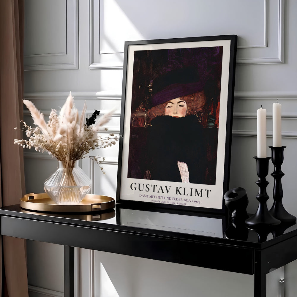 Atmospheric Viennese portrait poster of Gustav Klimt Dame Mit Hut Und Federboa 1909 created in Europe featuring a woman in a purple hat. Select an unframed fine art paper poster, a gallery stretched canvas print, or custom framed wall decor directly from MapYourDreams.