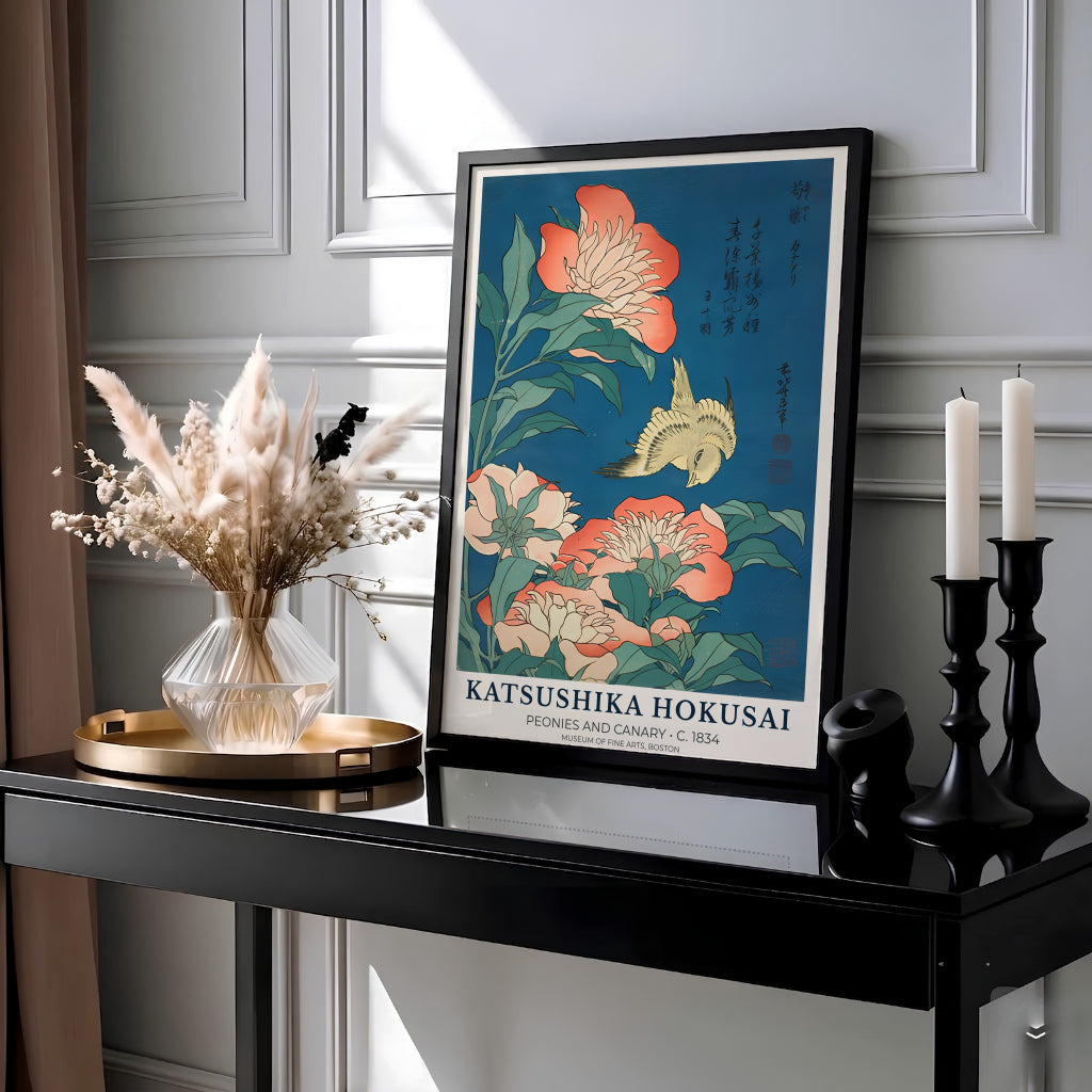 Vintage Edo period Japanese bird and flower poster of Peonies and Canary by artist Katsushika Hokusai showing a yellow canary over coral peonies in Boston. Available as unframed prints, gallery canvas, or framed wall decor at MapYourDreams.
