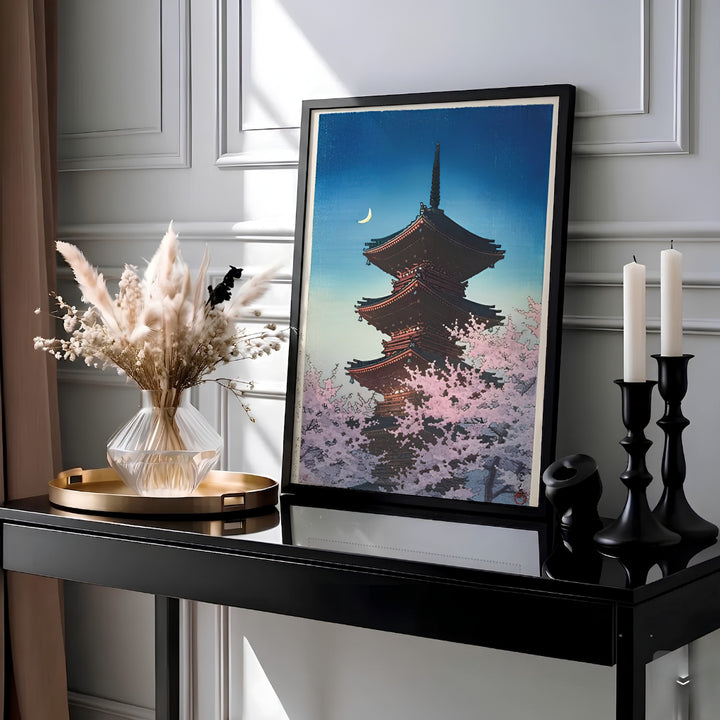 Vintage Japanese travel woodblock poster Spring Evening Ueno by artist Kawase Hasui showing illuminated pagoda tiers and pink sakura at Spring Evening Ueno. Available as unframed prints, gallery canvas, or framed wall decor at MapYourDreams.