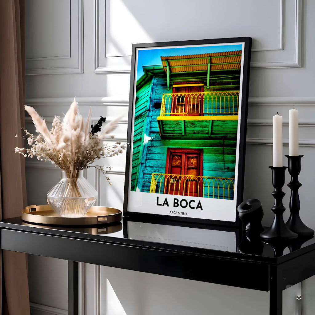 Colorful travel poster of El Caminito in Buenos Aires displaying saturated turquoise wood planks and a sunny yellow wrought-iron railing. Presented by MapYourDreams, this piece comes in flexible choices such as unframed paper stock, custom frames, and gallery canvas wraps.
