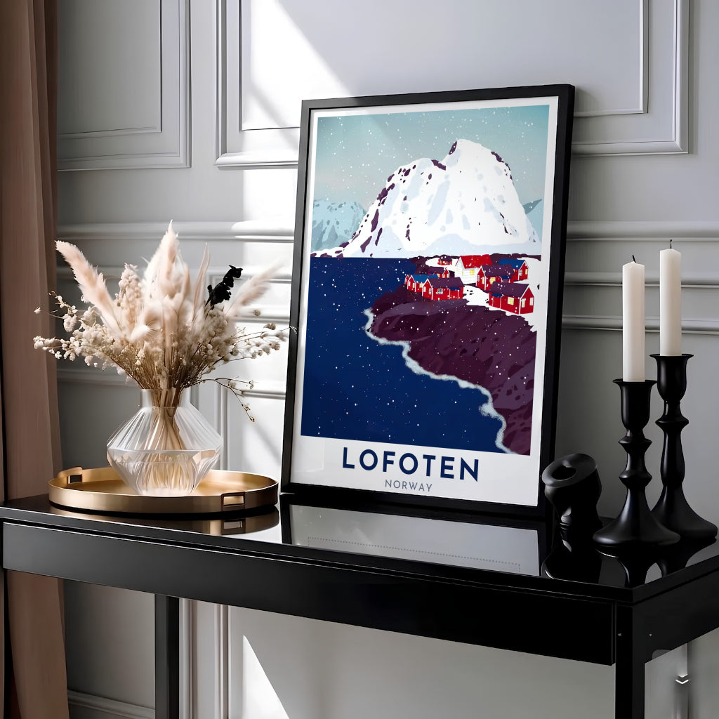 Graphical travel illustration of Lofoten Norway featuring deep navy fjord waters, falling snow, and bright red waterside cabins against sharp mountain peaks. Ideal for modern interiors, this art print is offered as a ready-to-hang framed poster, stretched canvas wrap, or classic unframed paper print.
