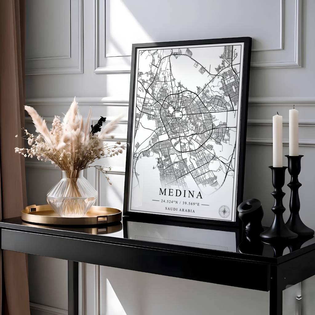 Elegant black and white city map poster of Medina Saudi Arabia with geographic coordinates, compass rose, and clean title text reading MEDINA. Presented by MapYourDreams, this artwork is available in flexible options including unframed paper, custom wooden frames, and gallery canvas wraps for living room art.
