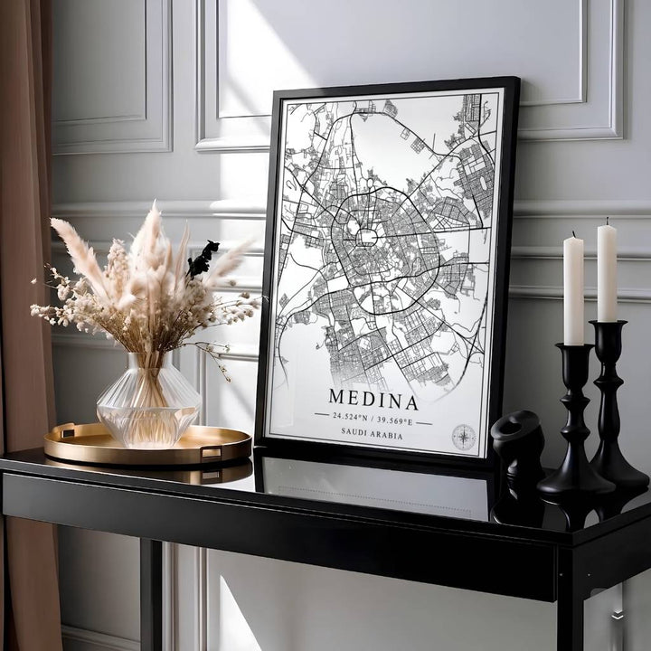 Elegant black and white city map poster of Medina Saudi Arabia with geographic coordinates, compass rose, and clean title text reading MEDINA. Presented by MapYourDreams, this artwork is available in flexible options including unframed paper, custom wooden frames, and gallery canvas wraps for living room art.