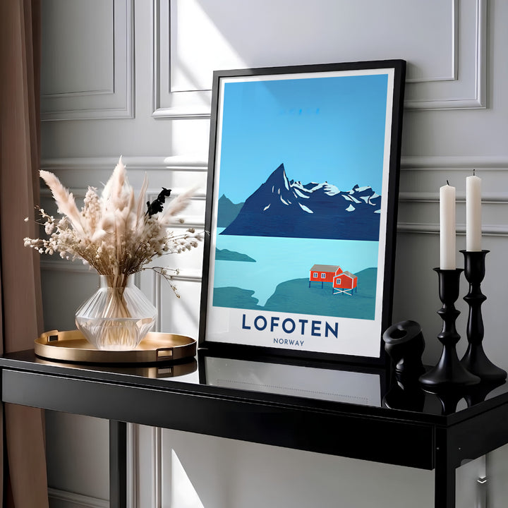 Contemporary vector print capturing Lofoten Norway with crimson waterfront cabins and a prominent Arctic mountain peak. Designed for modern interiors, this travel artwork comes as an unframed paper poster, solid wood framed print, or gallery wrapped canvas wall decor piece.