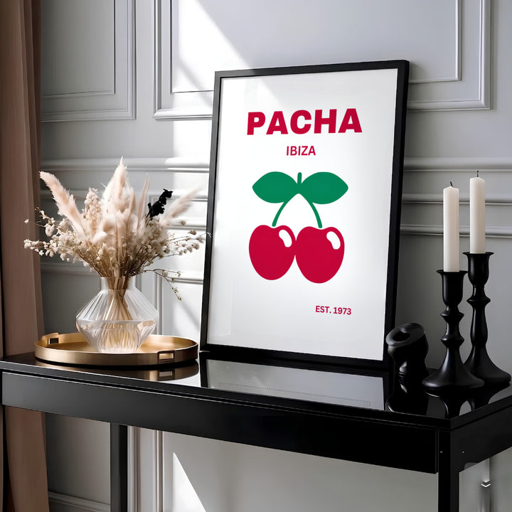 Retro 1973 music club poster featuring red cherries with green leaves for Pacha in Ibiza, Spain, available from MapYourDreams as an unframed poster print, stretched canvas art, or custom framed decor designed to elevate music lounges and apartment wall displays.
