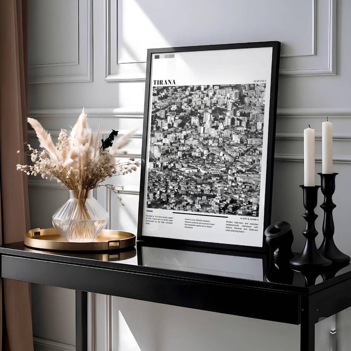 Showcasing the bustling metropolitan capital of Tirana Albania through dramatic Black &amp; White photography with geographic coordinates 41.3275° N, 19.8186° E, this travel photo print brings urban energy home. Available through MapYourDreams with display choices like unframed paper stock, custom frames, and stretched canvas options.