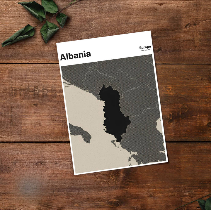 Fine art travel poster displaying the silhouette of Albania in bold charcoal black with exact coordinates 41.1533° N, 20.1683° E printed above. Offered by MapYourDreams, this artwork is available in flexible options including unframed paper, custom wooden frames, and gallery canvas wraps.