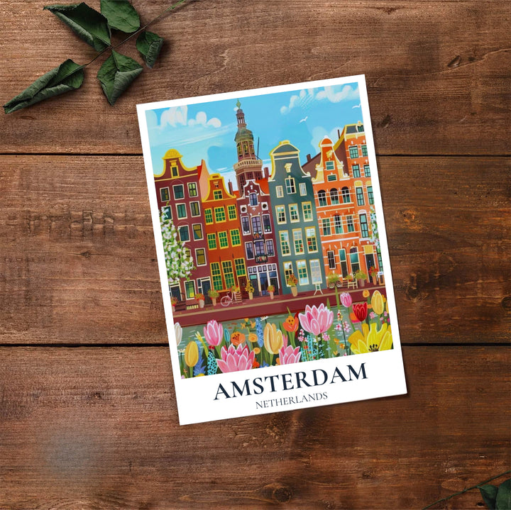 Amsterdam spring canal poster capturing historic gabled houses and lush tulip blooms under a light blue sky, offered by MapYourDreams as an unframed matte paper poster, a durable gallery wrapped canvas, or a selection of custom frames for living room and entryway wall styling.