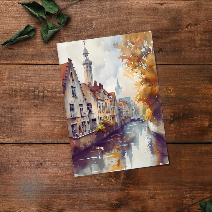 Fluid watercolor wall art detailing a peaceful canal way in Bruges, Belgium, framed by golden fall trees and historic gabled facades. Offered by MapYourDreams, this artwork is available in flexible options including unframed paper, custom wooden frames, and gallery canvas wraps.