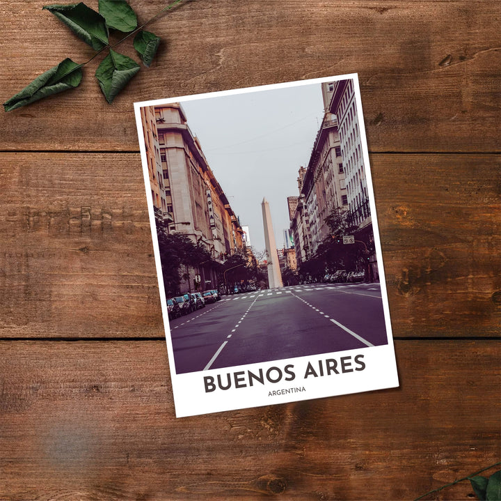 Cinematic photography poster of Avenida Corrientes in Buenos Aires capturing the white obelisk against moody sky gradients. Made by MapYourDreams, this artistic composition can be purchased as an unframed print, elegantly mounted in wood frames, or produced on stretched canvas.