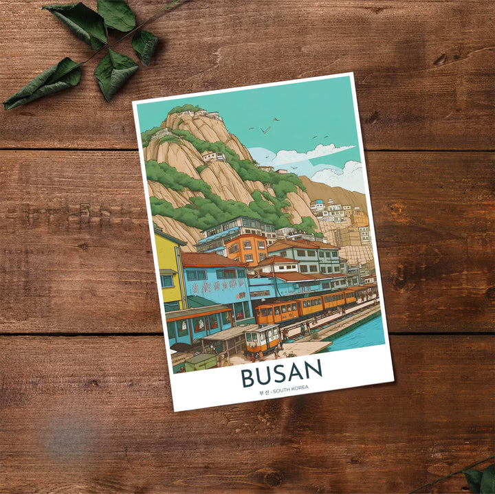 High-contrast line art travel print of Busan, South Korea, featuring bright yellow train cars, turquoise ocean harbor views, and towering mountain cliffs. Offered by MapYourDreams, this artwork is available in flexible options including unframed paper, custom wooden frames, and gallery canvas wraps.