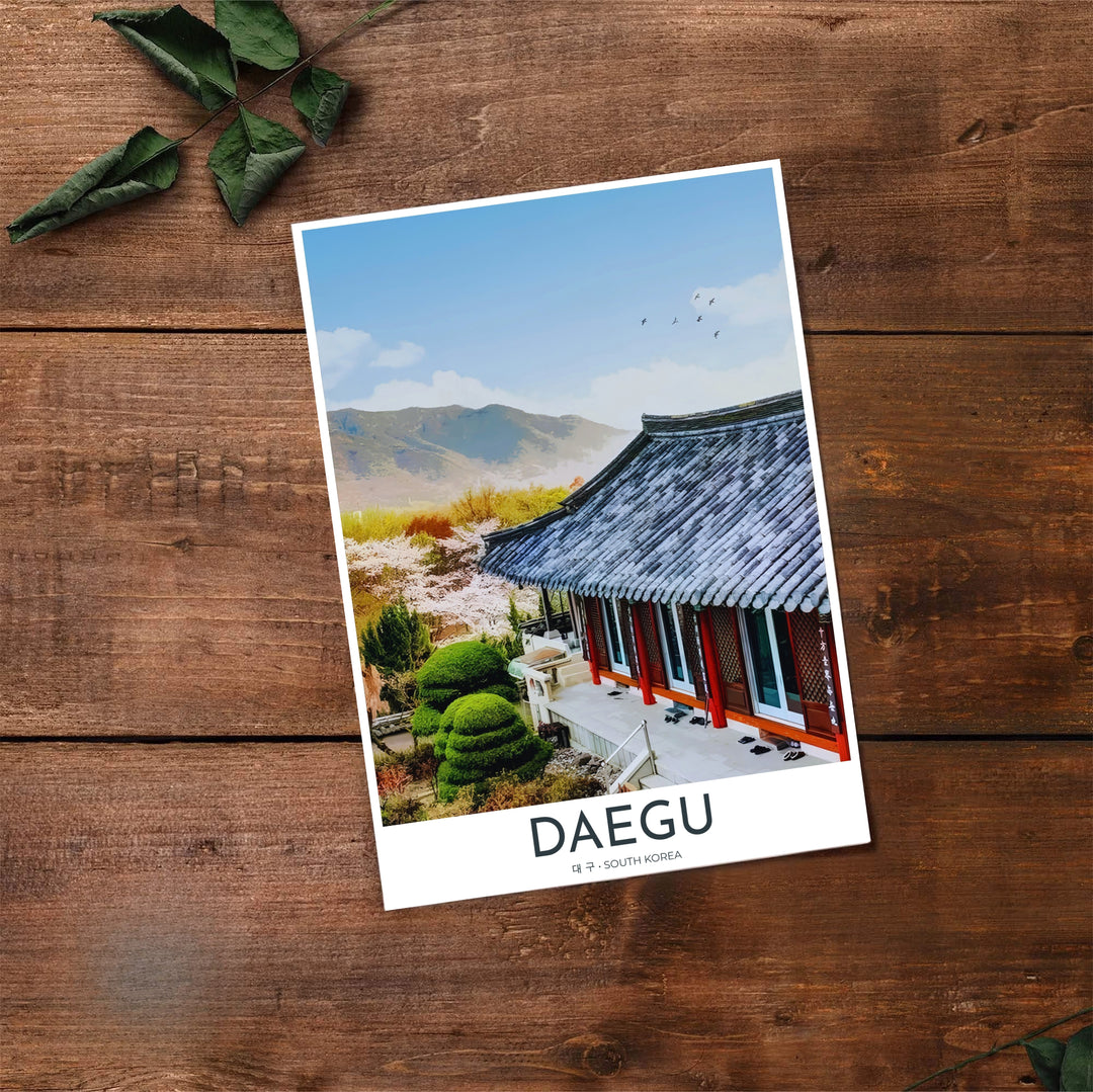High-contrast landscape travel poster of Donghwasa Temple in Daegu, South Korea, featuring vibrant orange support columns, dark giwa roof tiles, and distant green mountains. Offered by MapYourDreams, this artwork is available in flexible options including unframed paper, custom wooden frames, and gallery canvas wraps.