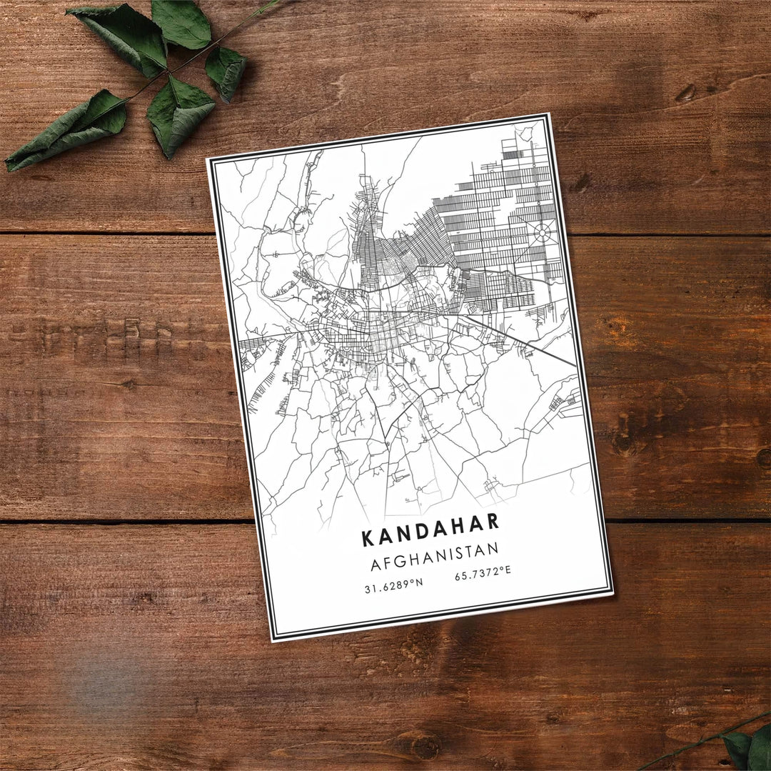 Monochrome city street map print showing the detailed road system and classic geographical text of Kandahar, Afghanistan. Available at MapYourDreams as an unframed print, a gallery canvas, or a custom framed wall decor piece in natural wood, white, and silver finishes for interior design projects.