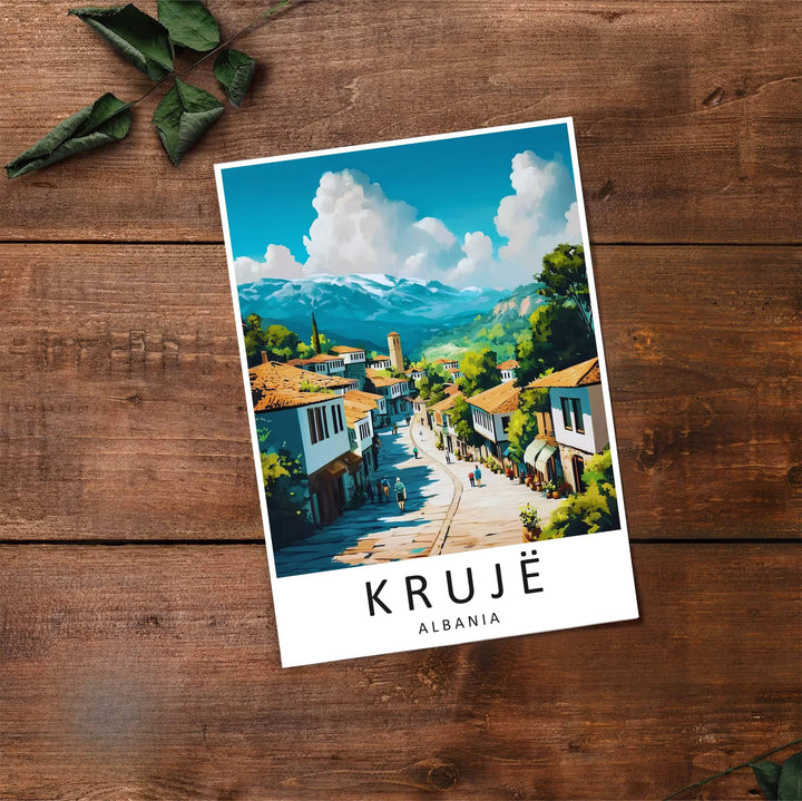 Fine art travel poster showing Krujë Old Bazaar with sunny skies, traditional houses, and historical landmarks displayed across an inviting street view. Choose from flexible display setups including unframed archival paper, wooden frames, or wrapped canvas formats.