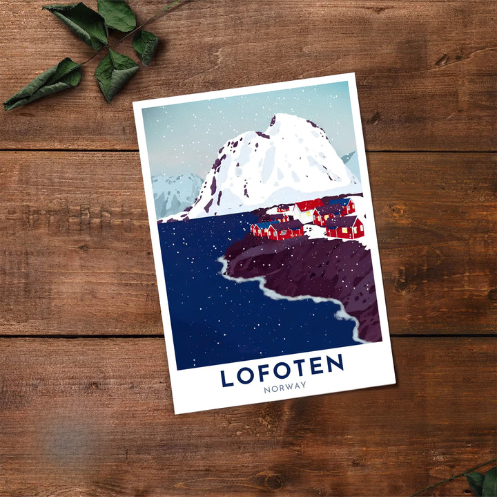 Expressive graphic print of Lofoten Norway highlighting giant snow peaks, navy fjord waters, and crimson waterside buildings under falling snow. A must-have for winter decor lovers, this fine art poster arrives in flexible formats including sleek framed styles, archival unframed prints, and stretched canvas options.