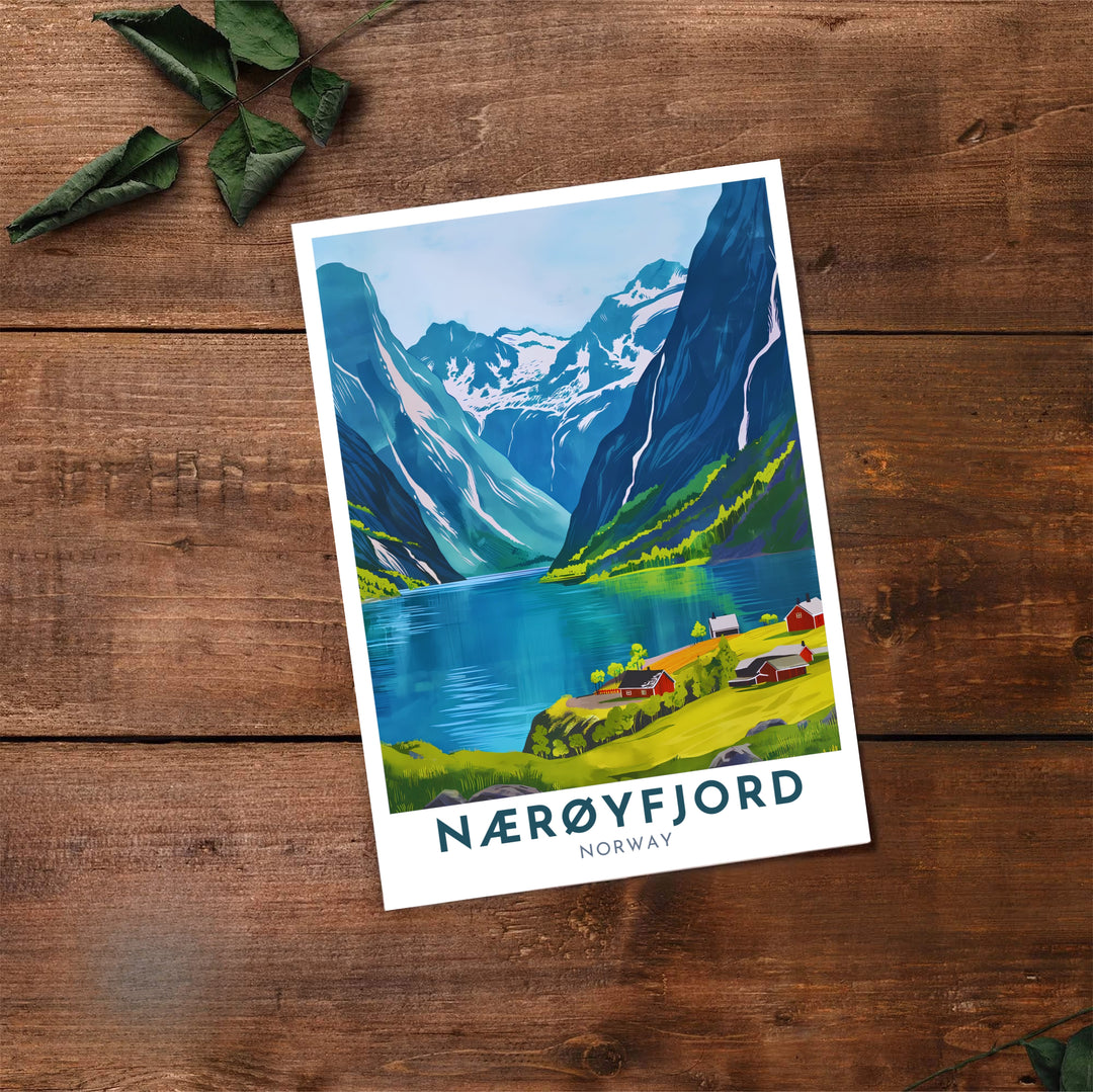 Expressive graphic print of Nærøyfjord Norway highlighting dramatic green mountains, blue fjord waters, and red countryside buildings. A must-have for nature lovers, this fine art poster arrives in flexible formats including sleek framed styles, archival unframed prints, and stretched canvas options.