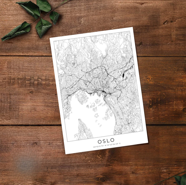 Sophisticated black and white city map illustration of Oslo Norway featuring crisp vector line art and bold capital typography. Created by MapYourDreams, choose from options like unframed paper prints, custom wood framed setups, or gallery wrapped canvas displays.