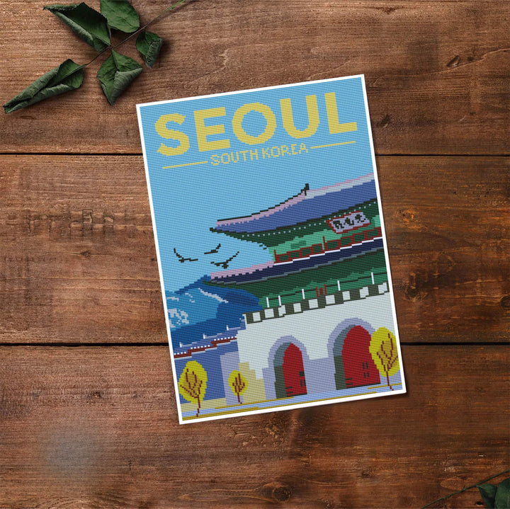Tactile cross-stitch effect travel print of Seoul, South Korea, featuring deep crimson doors, forest green pavilion roofs, crisp white masonry, and golden yellow trees. Offered by MapYourDreams, this artwork is available in flexible options including unframed paper, custom wooden frames, and gallery canvas wraps.