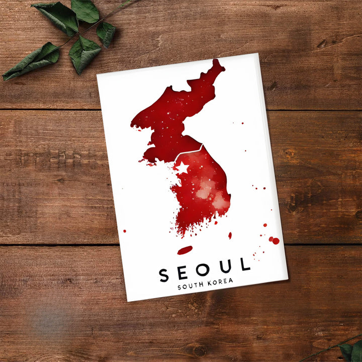 Panoramic style crimson watercolor map poster showing the peninsula shape and white star over Seoul, South Korea, created by MapYourDreams in flexible formats including unframed prints, retro black frames, and stretched canvas that serve as striking statement wall art.