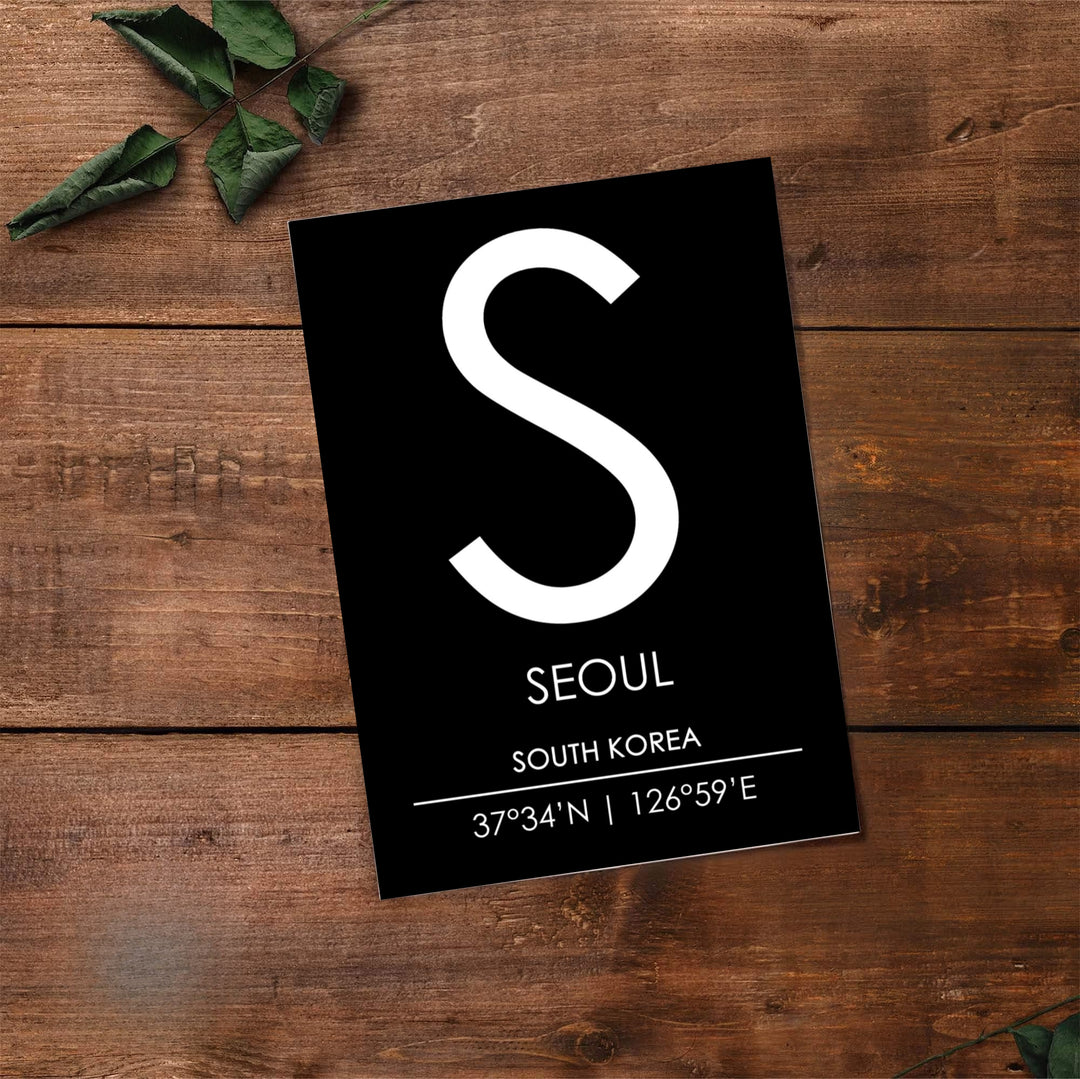 Panoramic style black background seoul monogram poster displaying letter S and detailed coordinates, created by MapYourDreams with flexible formats including unframed prints, retro black frames, and stretched canvas that serve as sophisticated statement wall art.
