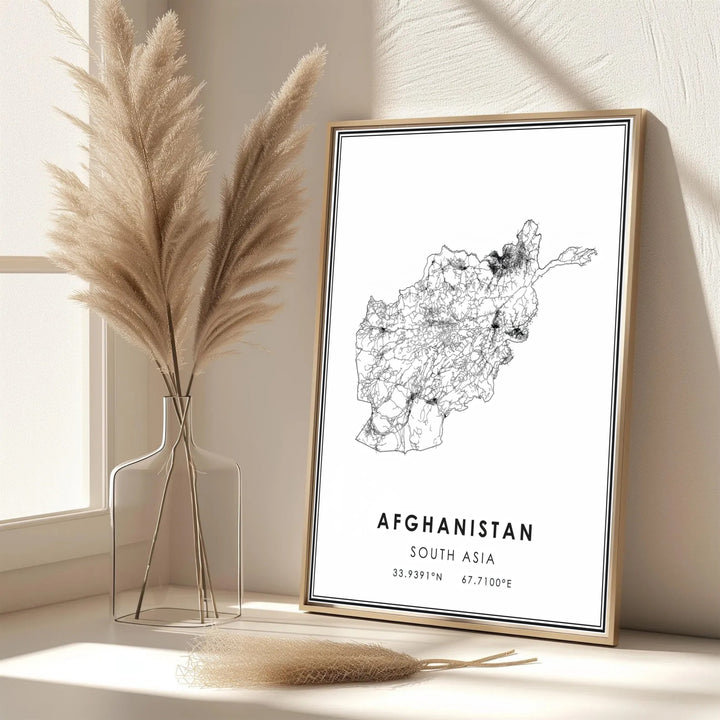 Graphic travel poster of Afghanistan featuring clean vector map lines and official country coordinate details, created by MapYourDreams with options for unframed art prints, stretched canvas wall decor, or custom framed prints in gold and silver finishes.