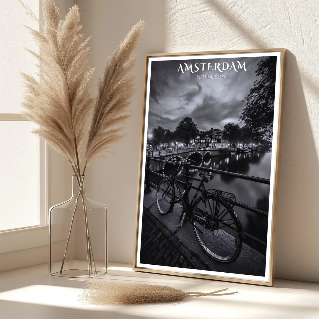 Elegant monochrome European print featuring dark canal waters and glowing architecture along an Amsterdam bridge, provided by MapYourDreams with options for an unframed paper print, a gallery wrapped canvas, or a custom framed presentation style for lovers of dramatic photography art.