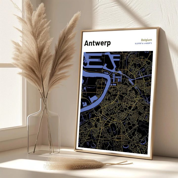 A refined city map print highlighting the road networks and urban landscape of Antwerp, Belgium with striking gold accents on a deep black background. Offered in flexible choices such as unframed archival poster paper, custom wood framing, and gallery canvas wraps.