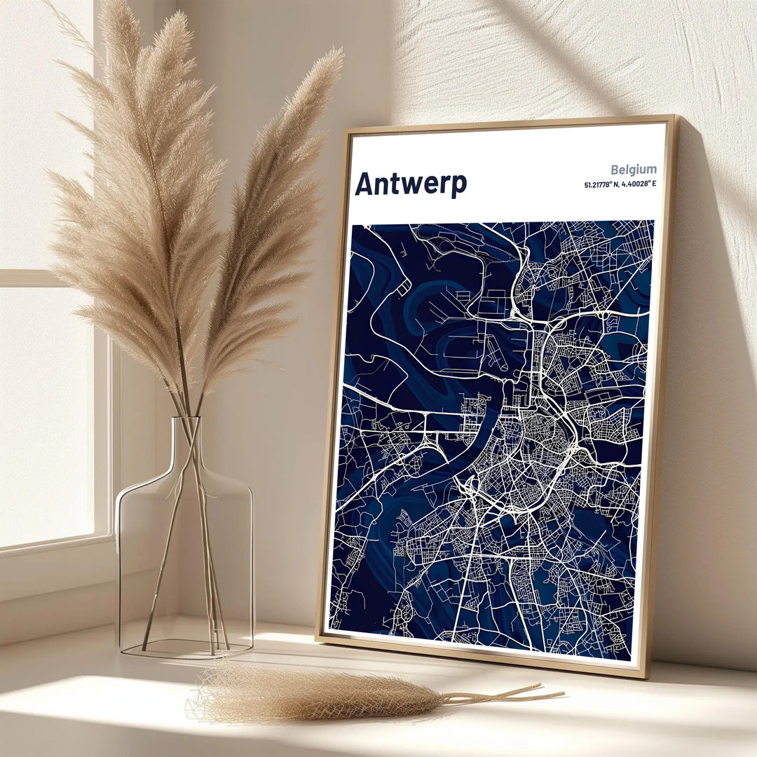 A refined city map print showcasing the street grid and geographical outline of Antwerp, Belgium, in rich navy blue and crisp white. Offered in flexible choices such as unframed archival poster paper, custom wood framing, and gallery canvas wraps.