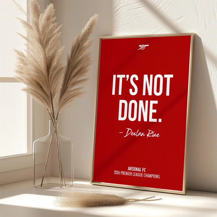 Full text print of Arsenal FC Declan Rice quote with historic cannon emblem from Emirates Stadium, available as unframed prints, framed wall art, or canvas options for North London art displays.