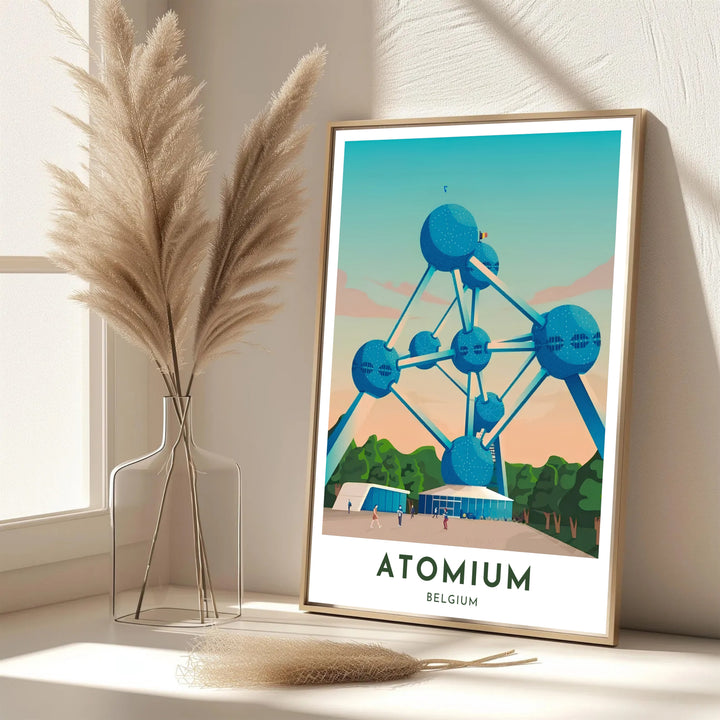 Modern European travel poster depicting the grand Atomium in Brussels, Belgium, in a sleek cyan, teal, and peach color scheme with clean typography. Offered in flexible choices such as unframed archival poster paper, custom wood framing, and gallery canvas wraps.