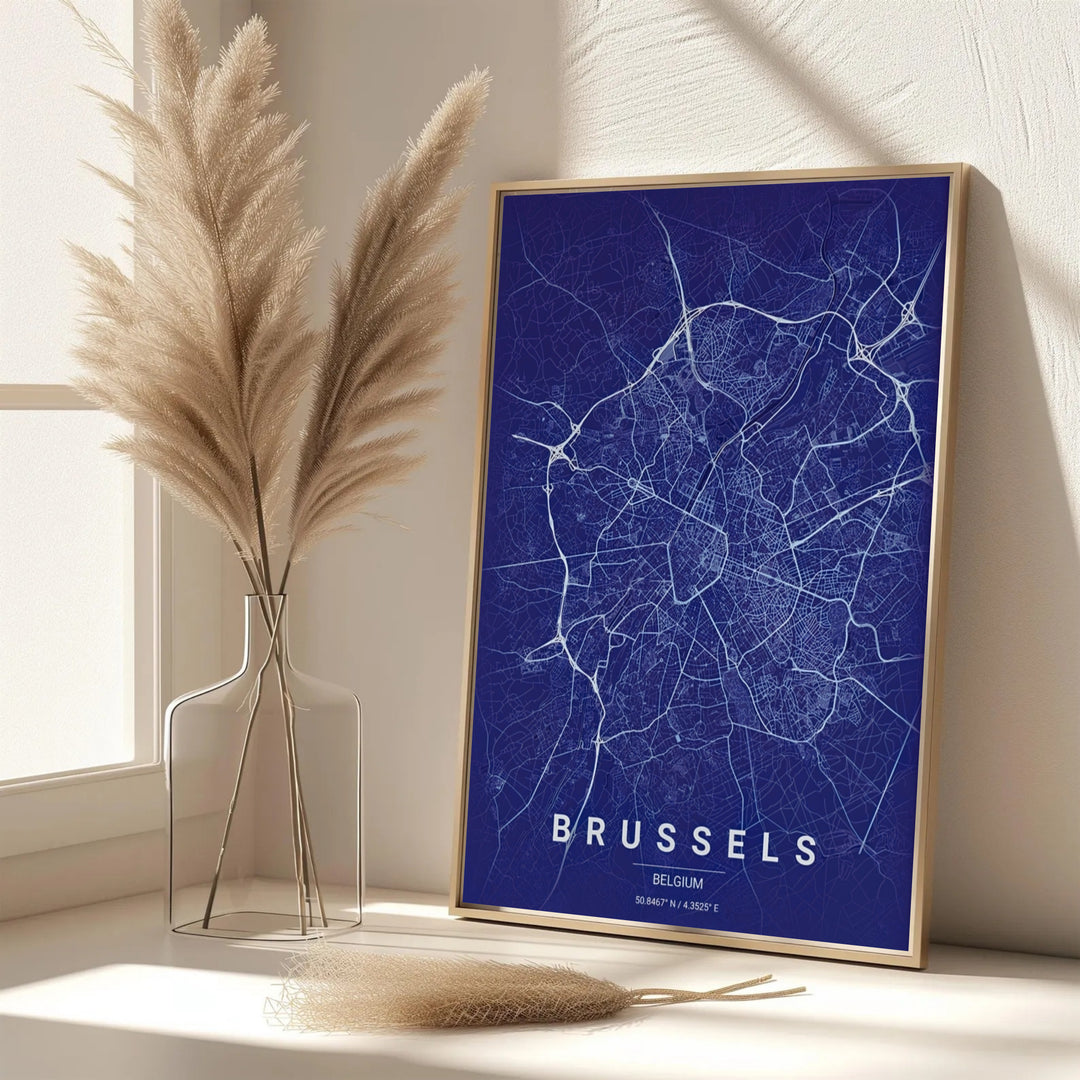 A picturesque Belgian city map print featuring the roadways and urban network of Brussels, Belgium, in a navy blue minimalist aesthetic. Offered in flexible choices such as unframed archival poster paper, custom wood framing, and gallery canvas wraps.