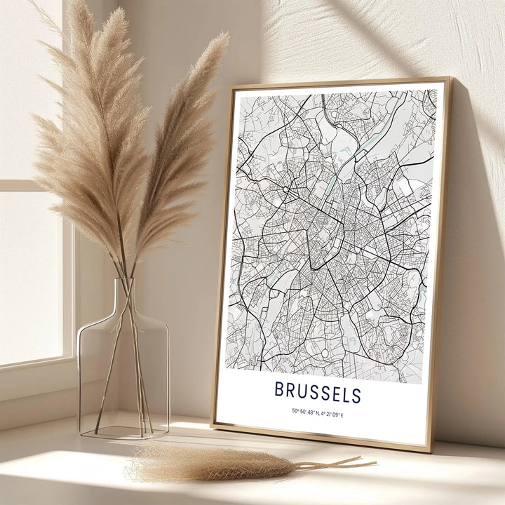 A picturesque Belgian city map print featuring crisp black street lines and off-white negative space of Brussels in Belgium. Offered in flexible choices such as unframed archival poster paper, custom wood framing, and gallery canvas wraps.