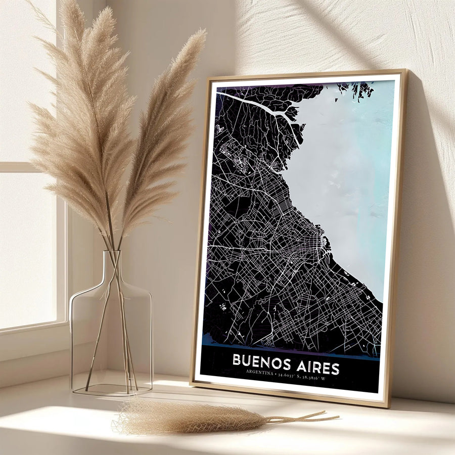 Sleek urban map wall art of Buenos Aires in Argentina showing the contrast between dark city terrain and luminous blue coastal waters. Available directly from MapYourDreams, this print comes in versatile mediums including roll-packed paper, custom frames, or stretched canvas wraps.