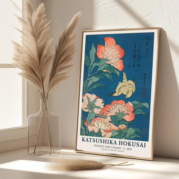 Elegant Japanese oriental floral poster Peonies and Canary by artist Katsushika Hokusai featuring coral peonies and a yellow bird in Boston. MapYourDreams features framed, unframed, and canvas print options for office wall art decor.