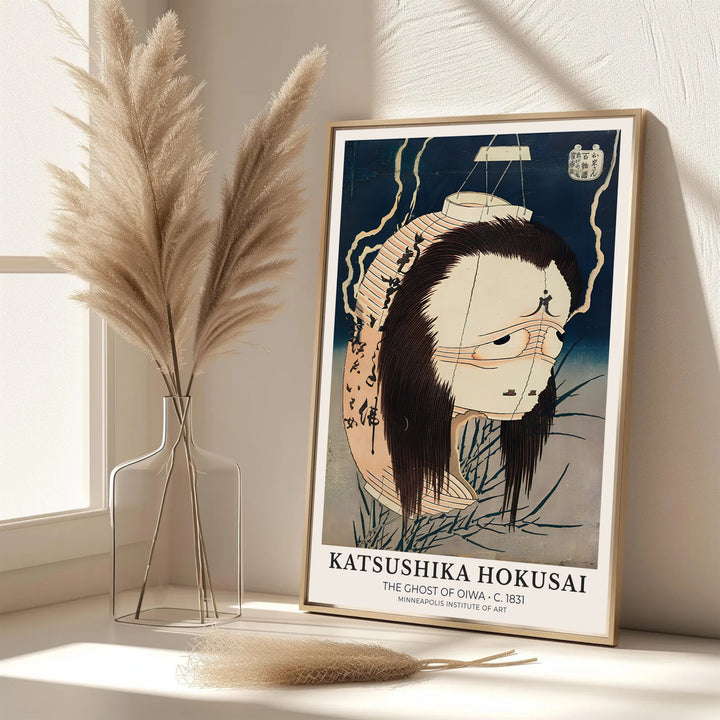 Elegant Japanese folklore poster of The Ghost of Oiwa by artist Katsushika Hokusai featuring a paper lantern ghost spirit in Minneapolis. MapYourDreams features framed, unframed, and canvas print options for office wall art decor.
