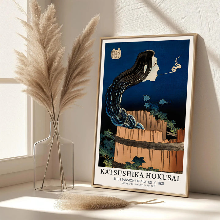 Elegant Japanese folklore poster of The Mansion of Plates by artist Katsushika Hokusai featuring the ghost of Okiku in Minneapolis. MapYourDreams features framed, unframed, and canvas print options for office wall art decor.