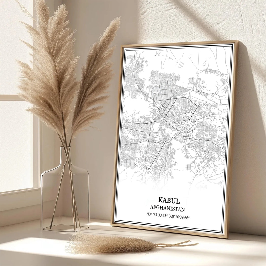 Minimalist black and white poster of Kabul Afghanistan showcasing geographic road networks and coordinate details, created by MapYourDreams with options for unframed art prints, stretched canvas wall decor, or custom framed prints in gold and classic black frame finishes.