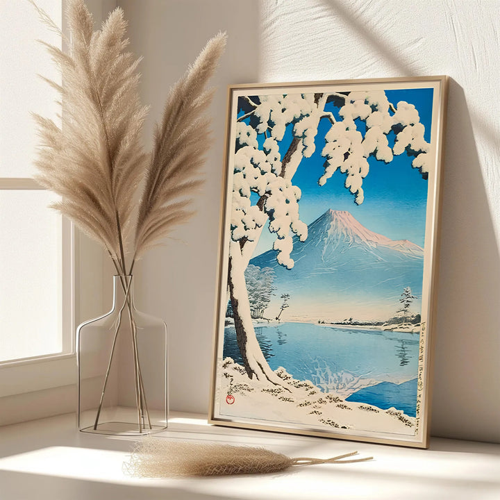 Dynamic Japanese snow poster Lake Kawaguchi by artist Kawase Hasui featuring heavy snow on pine trees at Lake Kawaguchi. MapYourDreams features framed, unframed, and canvas print options for office wall art decor.