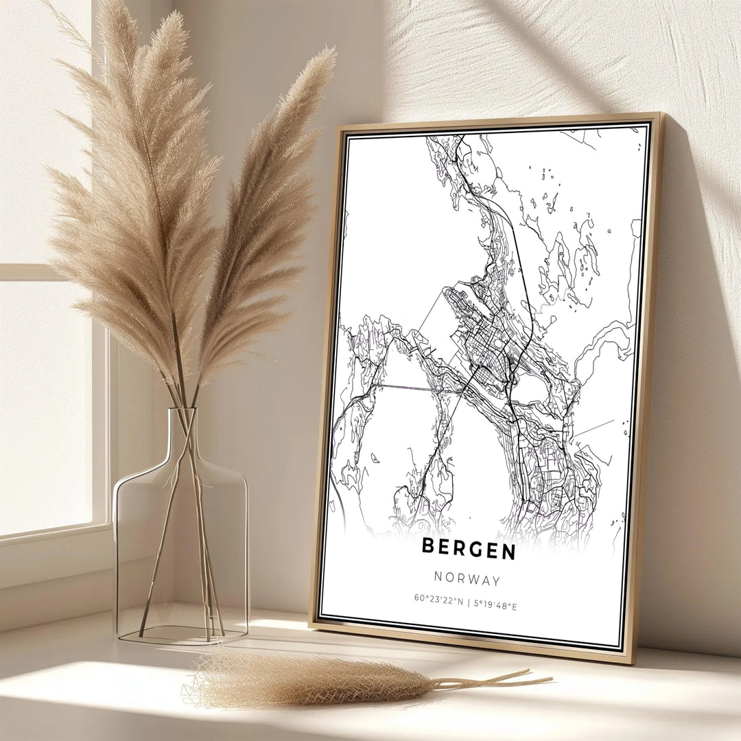 Modern black and white city layout artwork depicting the road map of Bergen Norway with clean graphic lines. Bring Scandinavian sophistication into your living area with this print available in classic unframed print paper, gallery wrapped canvas panels, or fully assembled framed displays.