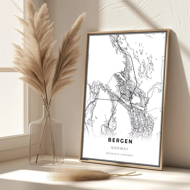 Modern black and white city layout artwork depicting the road map of Bergen Norway with clean graphic lines. Bring Scandinavian sophistication into your living area with this print available in classic unframed print paper, gallery wrapped canvas panels, or fully assembled framed displays.