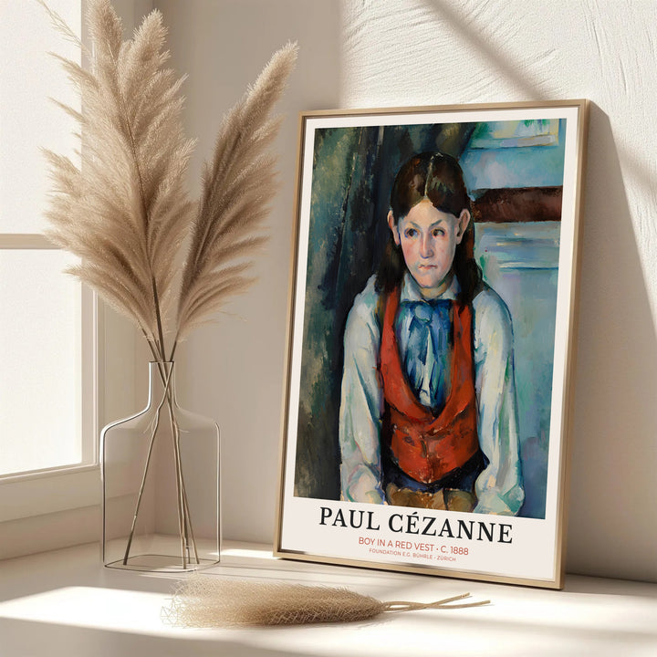 Elegant living room wall art print of Paul Cezanne Boy In Red Vest 1888 displaying detailed fabric textures in Paris France. MapYourDreams features custom framed prints, unframed paper wall decor, and gallery canvas options for refined home wall layouts.