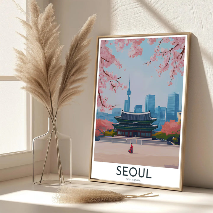 Vibrant South Korean cultural decor print showcasing Gyeongbokgung Palace in Seoul under a soft sky with blooming pink cherry trees and the distant needle of N Seoul Tower. Offered by MapYourDreams, this artwork is available in flexible options including unframed paper, custom wooden frames, and gallery canvas wraps.