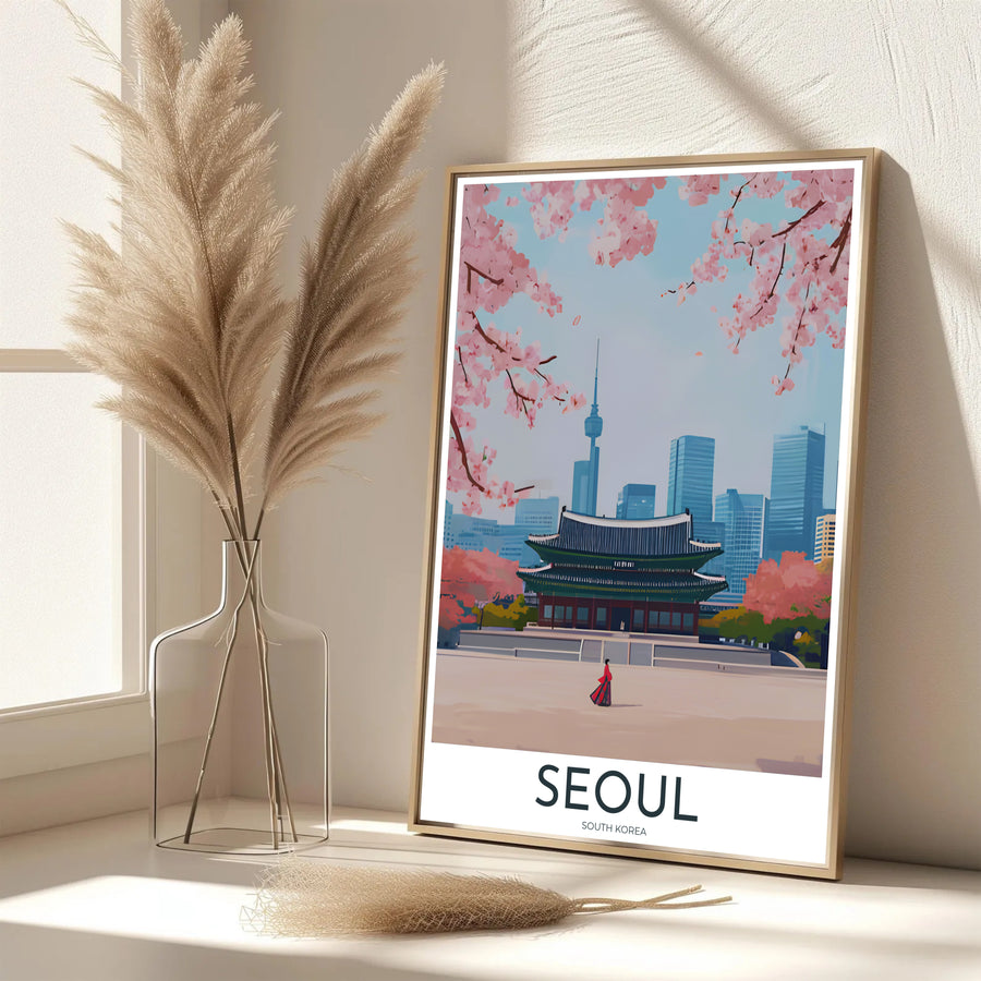 Vibrant South Korean cultural decor print showcasing Gyeongbokgung Palace in Seoul under a soft sky with blooming pink cherry trees and the distant needle of N Seoul Tower. Offered by MapYourDreams, this artwork is available in flexible options including unframed paper, custom wooden frames, and gallery canvas wraps.