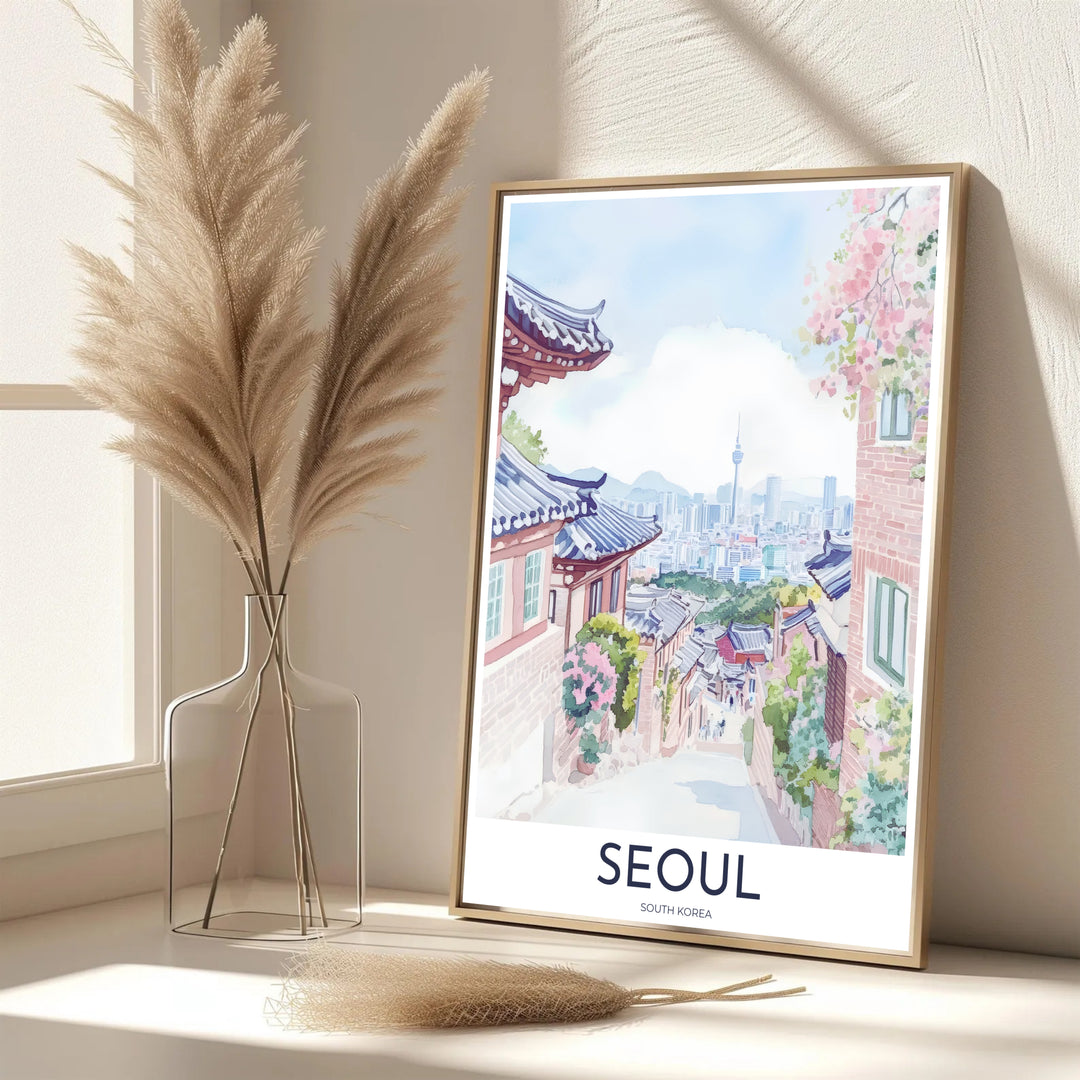 Vibrant pastel South Korean decor print showcasing a picturesque Bukchon Village pathway in Seoul surrounded by gentle floral clusters, traditional Hanok walls, and N Seoul Tower. Offered by MapYourDreams, this artwork is available in flexible options including unframed paper, custom wooden frames, and gallery canvas wraps.