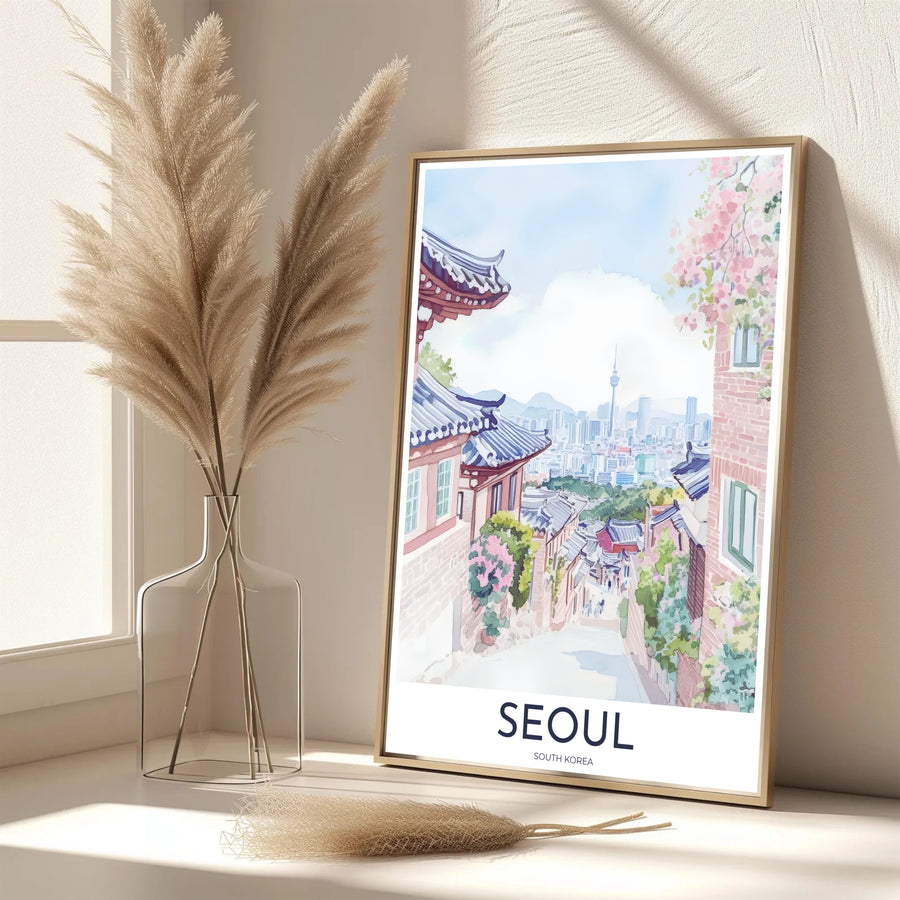 Vibrant pastel South Korean decor print showcasing a picturesque Bukchon Village pathway in Seoul surrounded by gentle floral clusters, traditional Hanok walls, and N Seoul Tower. Offered by MapYourDreams, this artwork is available in flexible options including unframed paper, custom wooden frames, and gallery canvas wraps.