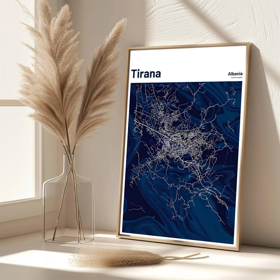 Elegant vertical typography frames this detailed road map of Tirana, offering a clean navy aesthetic for home offices and executive spaces. Available from MapYourDreams as an unframed paper poster, custom-framed print, or gallery-wrapped canvas.