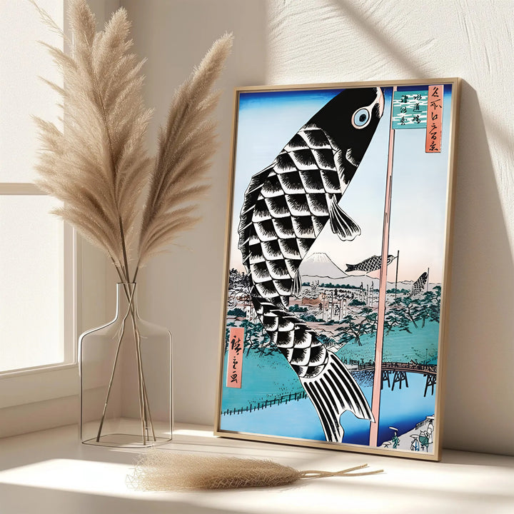 Elegant Japanese festival poster Giant Carp Streamer by artist Utagawa Hiroshige featuring large black carp streamer in Mount Fuji Suidō Bridge. MapYourDreams features framed, unframed, and canvas print options for office wall art decor.