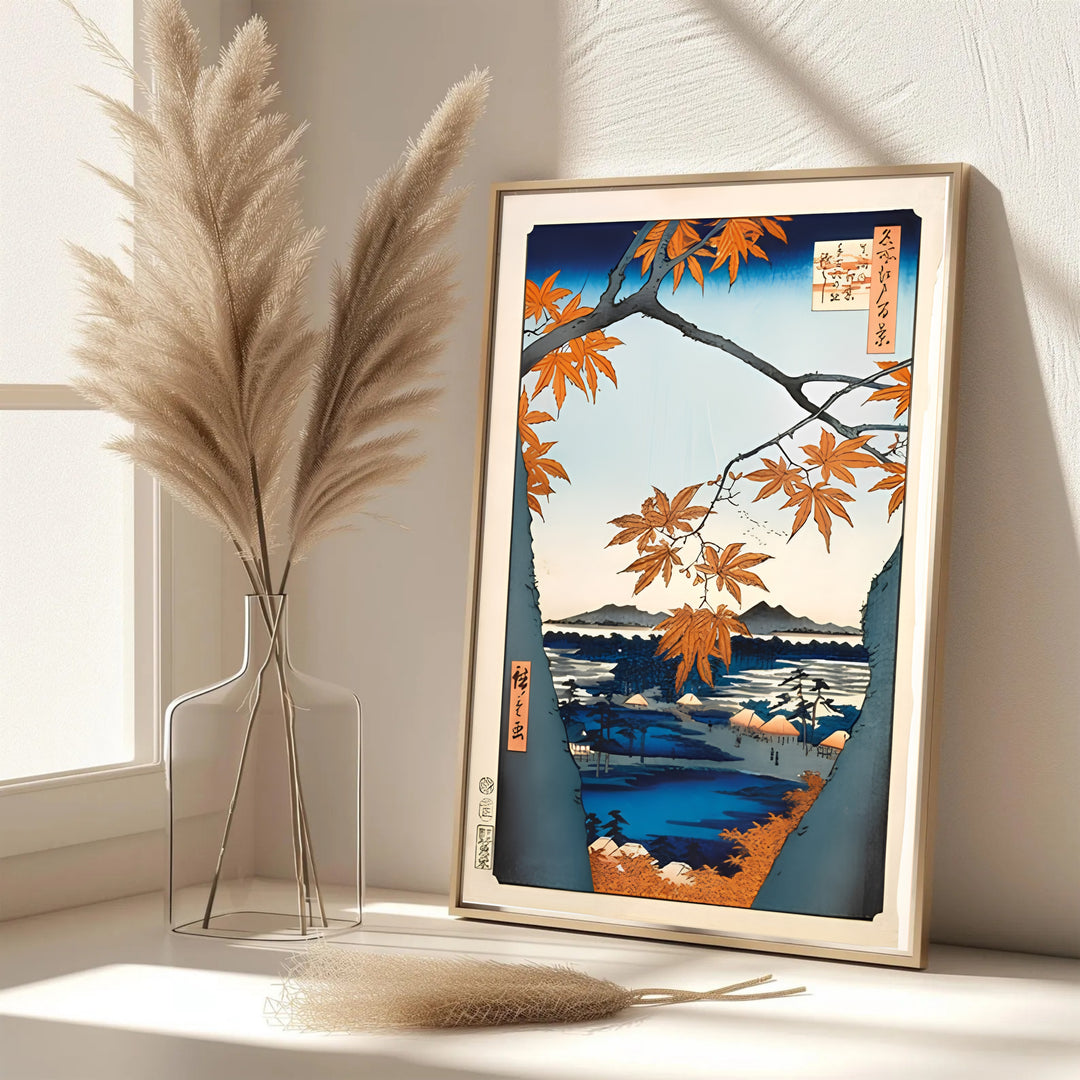 Elegant Japanese autumn poster Maple Trees at Mama by artist Utagawa Hiroshige featuring maple branches over river at Maple Trees at Mama and Tekona Shrine. MapYourDreams features framed, unframed, and canvas print options for living room wall art decor.
